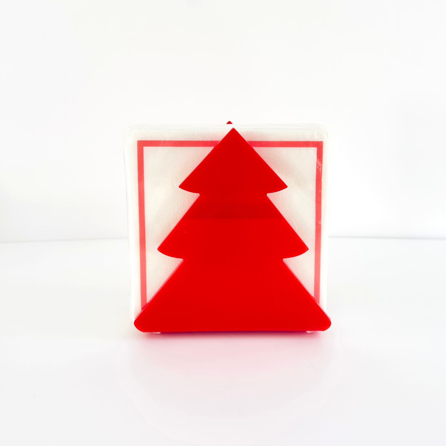 Red Christmas tree-shaped object on a white background