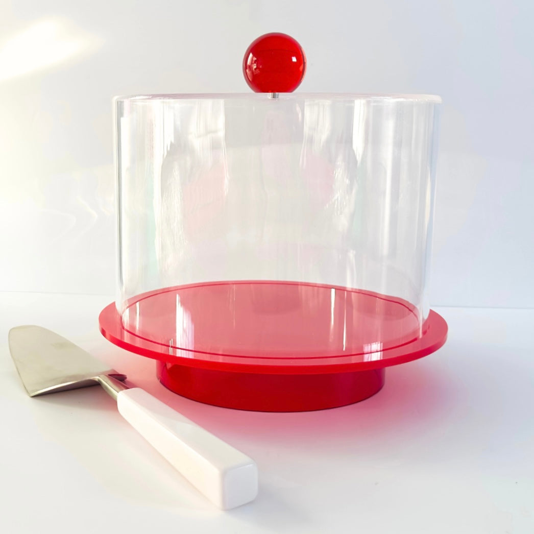 Tara Pastry Tray - britt elizabeth red and clear acrylic cake tray with serving spatula  on a white table