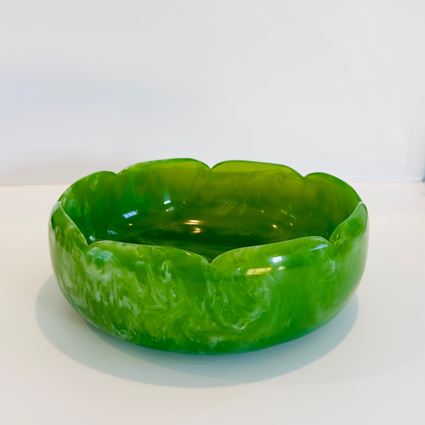 Green resin bowl on a white background