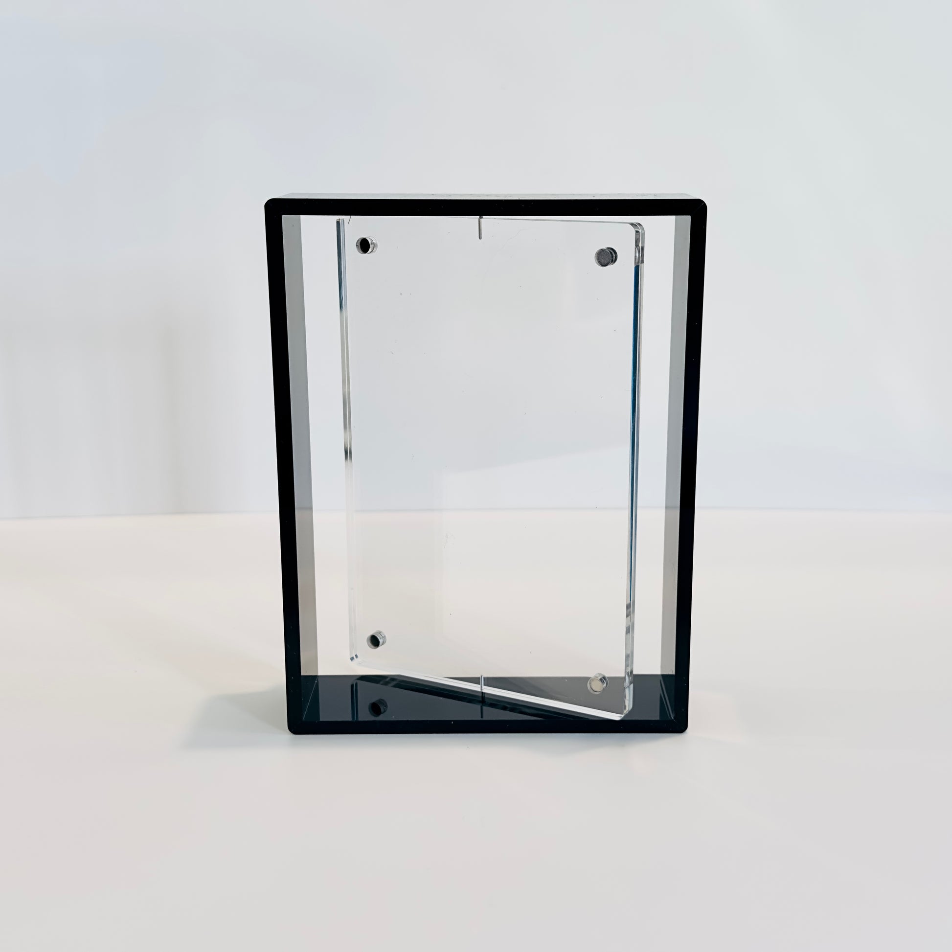 Clear rectangular photo frame inside a black frame on a white background