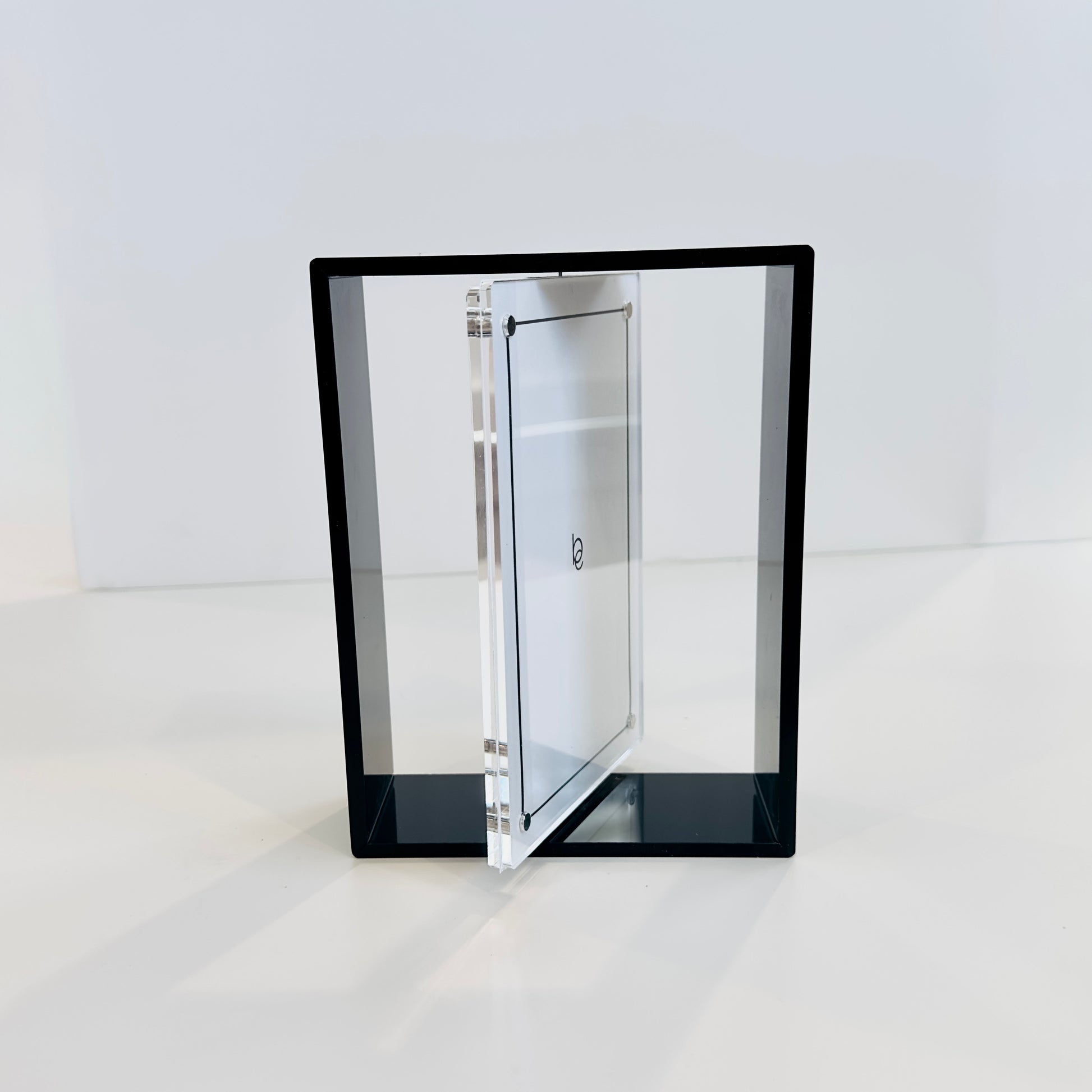Clear photo frame with black frame on a white background