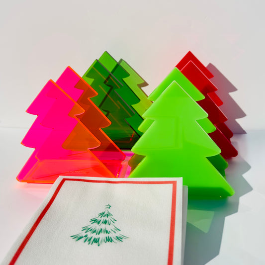 Colorful Christmas tree-shaped napkin holders on a white background