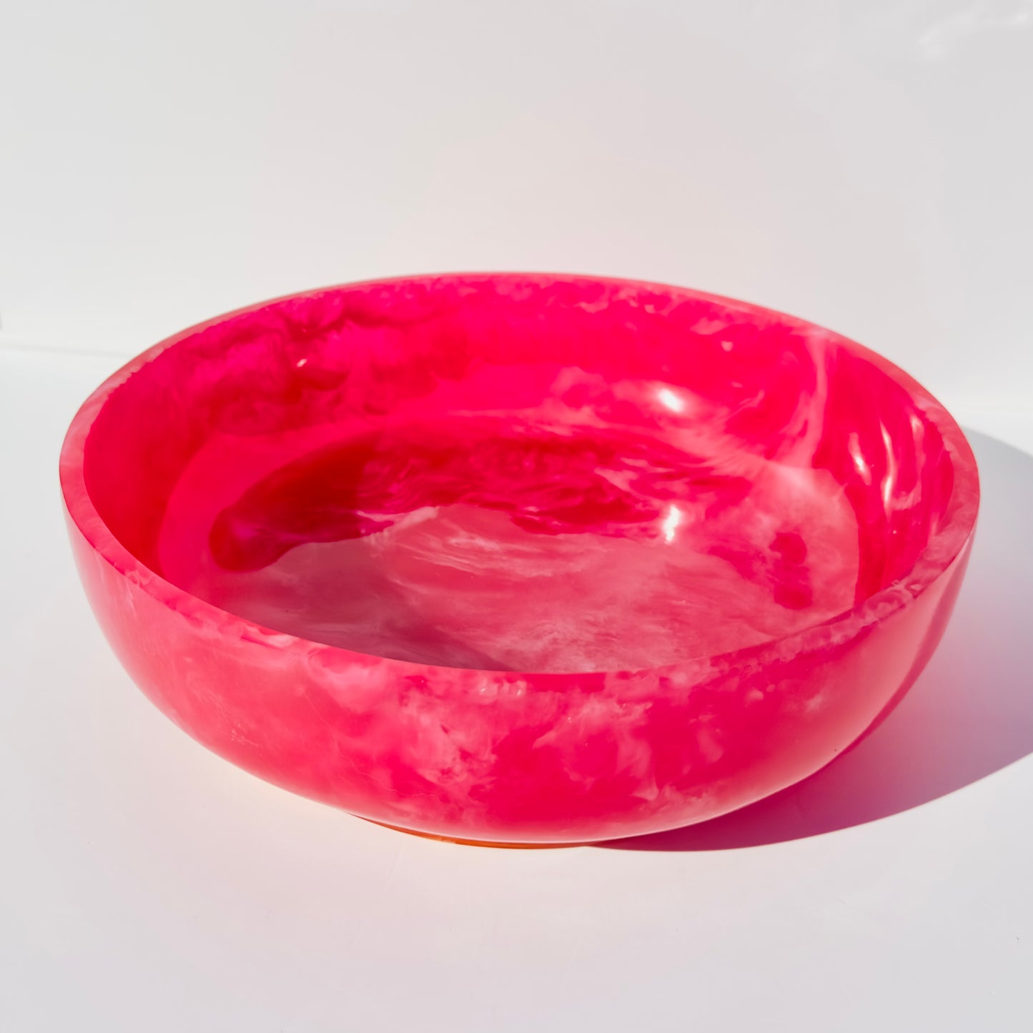 Pink marbled bowl on a white background