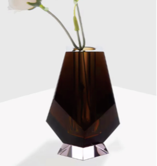 Smoky brown vase with a geometric design on a white surface