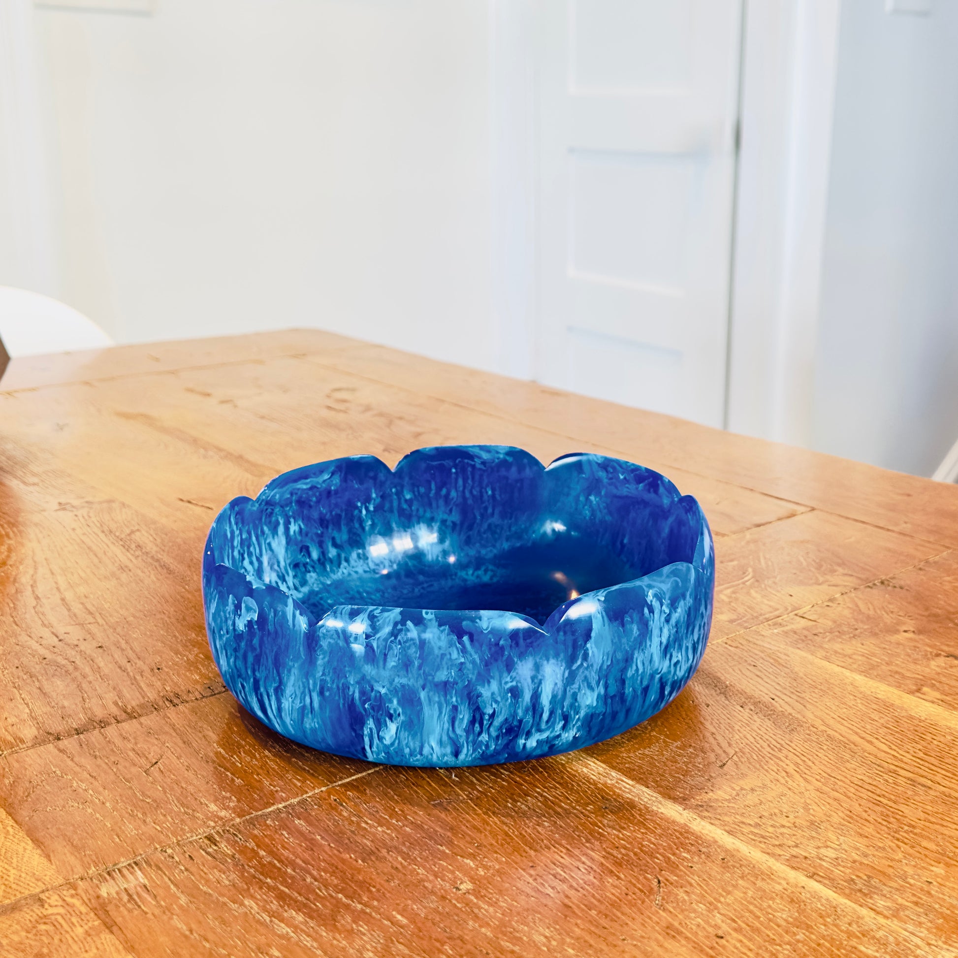 Blue marble-patterned bowl on a wooden surface
